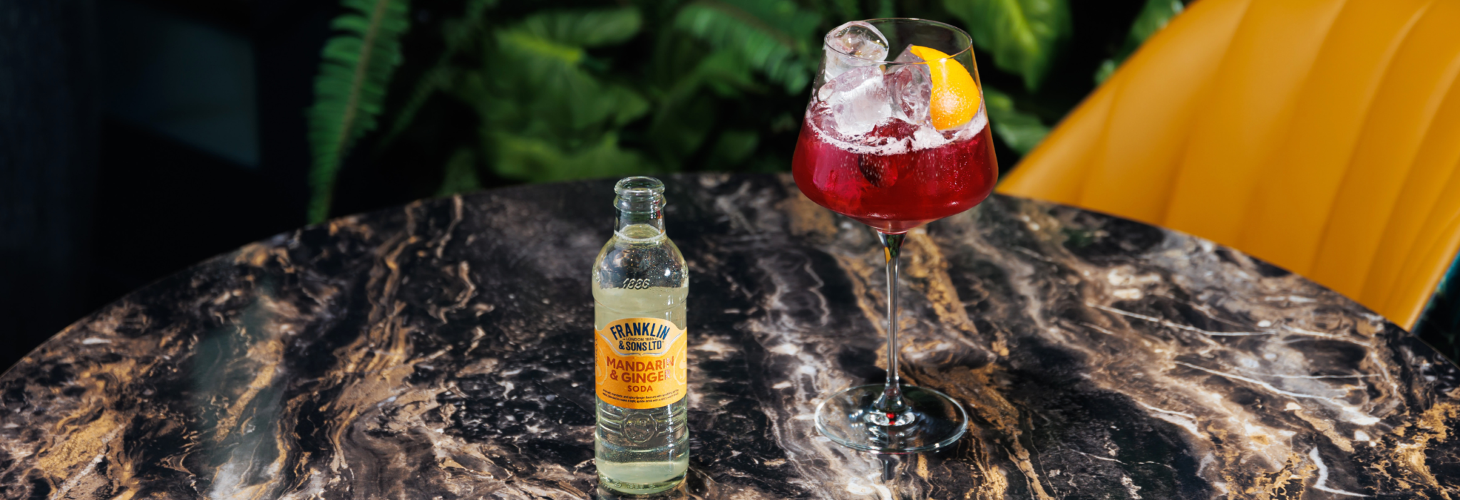 mandarin and ginger soda next to a red spritz cocktail | Franklin & Sons